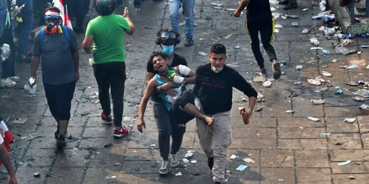 Masked gunmen attack protesters in Iraq holy city; 18 killed