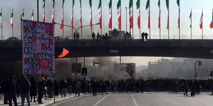 Protests grip major Iranian cities over gas prices; at least 1 killed