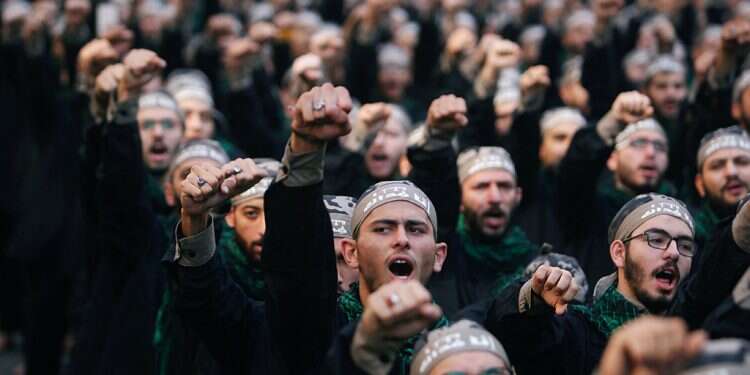 Hezbollah supporters march in Beirut Germany reportedly poised to outlaw Hezbollah next week