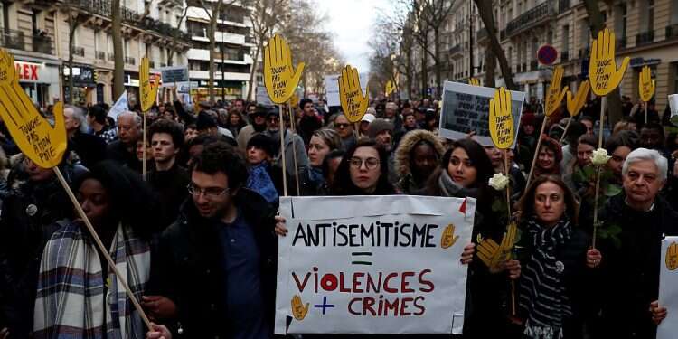 People and officials attend a demonstration against anti-Semitism organized by CRIF following the anti-Semitic murder of Mireille Knoll, 85, in Paris in 2018 Guards at Jewish school in France bar would-be anti-Semitic attacker