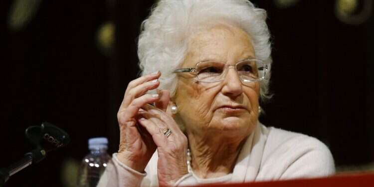 Holocaust survivor Liliana Segre speaks with young students during a Holocaust memorial ceremony in Milan, Jan. 24, 2018 Auschwitz survivor a focus of Italy's anti-Semitic tensions