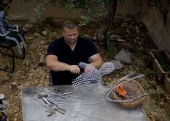 Palestinian photographer finds new career as wire sculptor