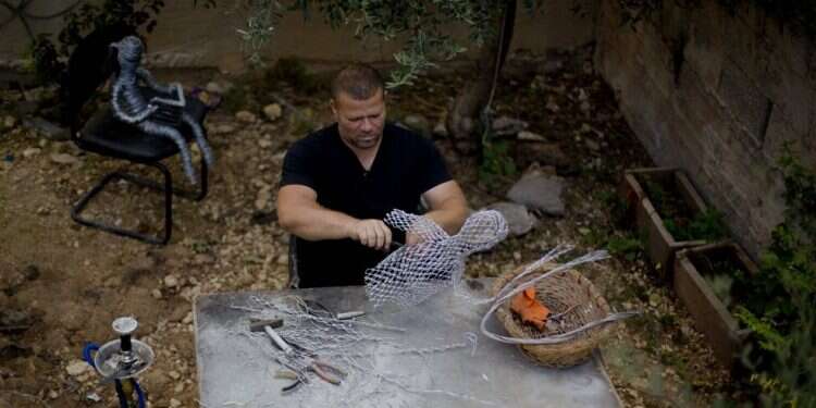 Palestinian photographer finds new career as wire sculptor