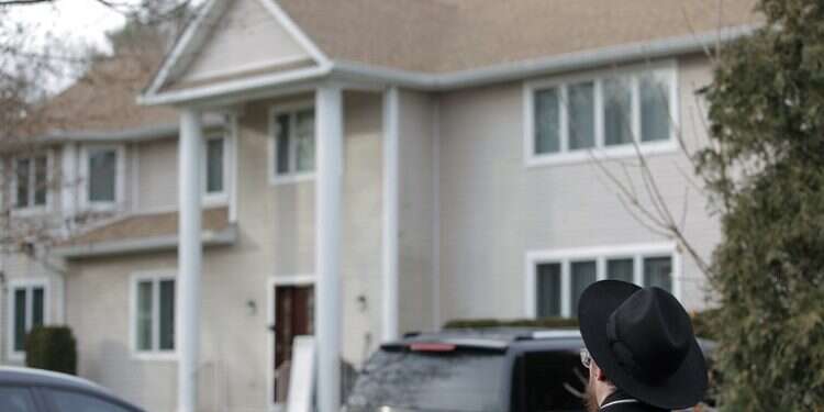 An onlooker stands outside a rabbi's residence in Monsey, NY, Sunday, following a stabbing attack Saturday night during a Hanukkah celebration (AP/Julius Constantine Motal) On the precipice of a volcano – history repeating itself for US Jews