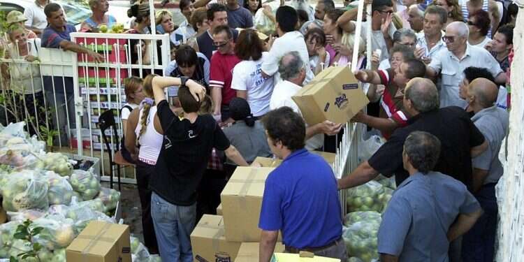 Food is distributed at a soup kitchen in Haifa Over 1 million children in Israel are hungry, report shows