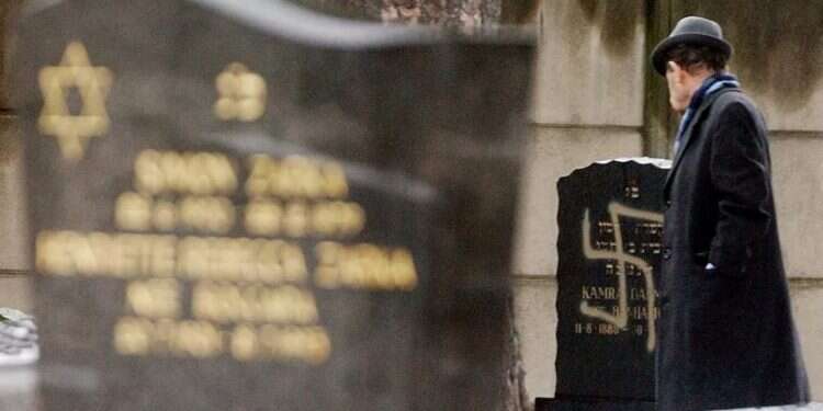 A grave desecrated with a swastika at the Jewish cemetery of Strasbourg-Cronenbourg, in eastern France Poll: Majority of Israelis fear for Jews living in France