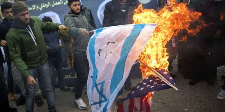 Paying tribute to Iran's Soleimani, Gazans torch US, Israeli flags