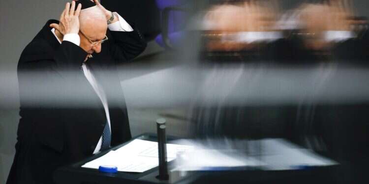 Israeli President Reuven Rivlin places a kippah on his head as he speeches during a special meeting of the German Parliament Bundestag commemorating the victims of the Holocaust in Berlin Rivlin mourns Holocaust victims at German parliament