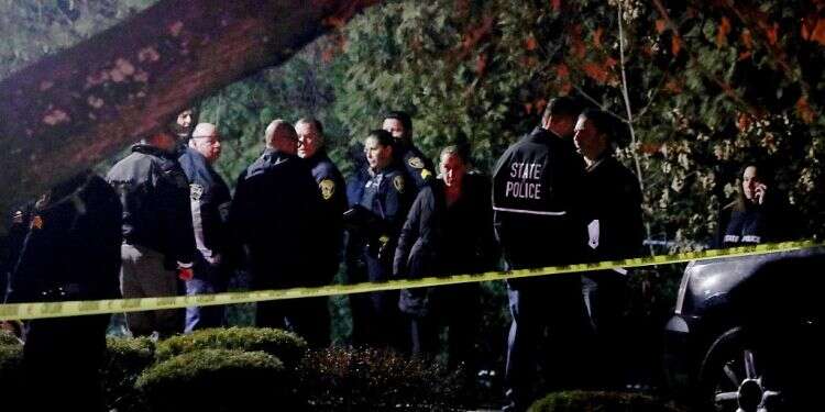 Police gather outside a residence in Monsey, NY, early Sunday, Dec. 29, 2019, following a stabbing Saturday during a Hanukkah celebration Jewish residents of NY community seek handgun permits for self-defense