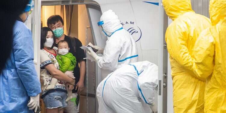 Hubei province residents, disembarking a chartered Xiamen Airline plane, arrive at Wuhan Tianhe International Airport in Wuhan, Hubei Province, China, 31 January 2020 Health Ministry announces major restrictions on Israelis, tourists arriving from Asia