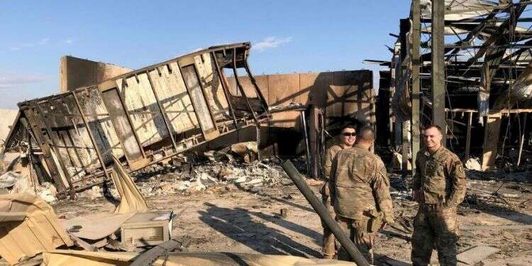 US soldiers are seen at the site where an Iranian missile hit Ain al-Asad air base in Anbar province, Iraq (Reuters/John Davison) Over 100 US troops diagnosed with brain injuries from Iran strike
