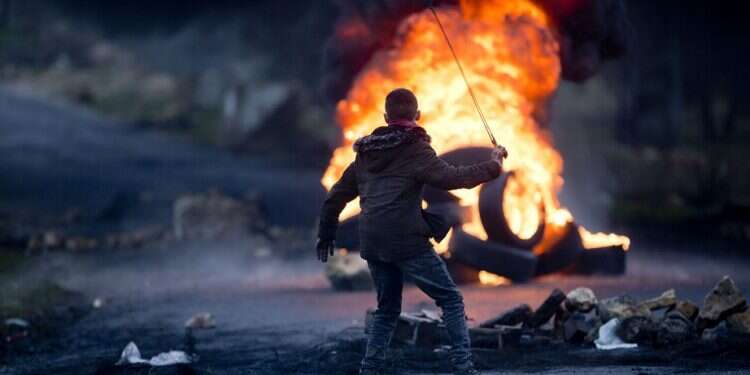 Palestinians clash with Israeli forces in Ramallah on Tuesday Poll: 94% of Palestinians reject Trump plan, 64% favor return to armed struggle