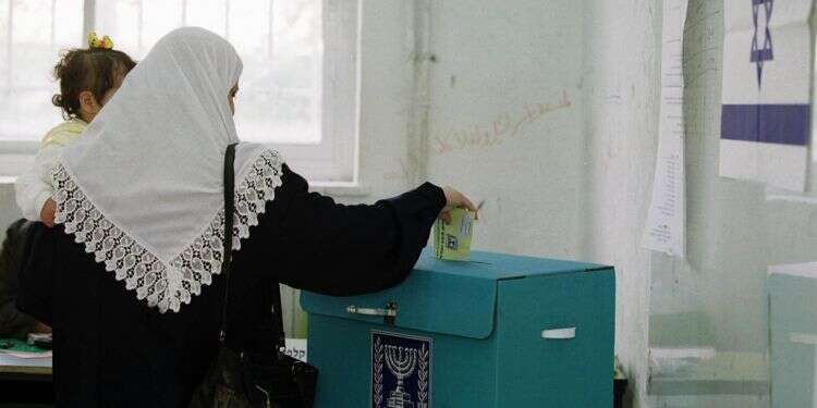 An Israeli-Arab voter drops a ballot into a ballot box in east Jerusalem Anger at Trump's peace plan could mobilize Arab voters in Israel