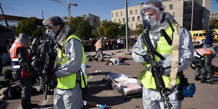Home Front Command troops during a hazardous materials exercise If infection rate spikes, IDF to be tasked with policing Israel's cities