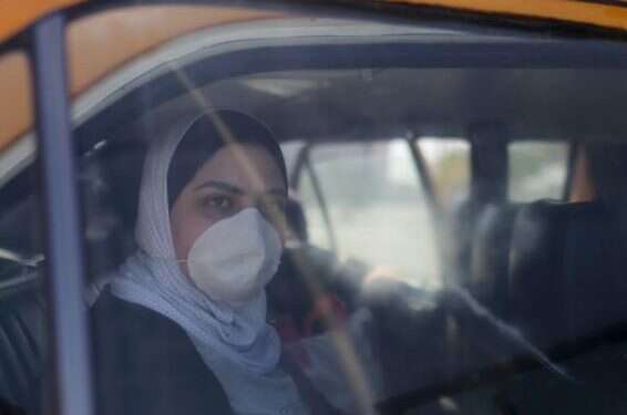 A Palestinian woman, wearing a mask as a preventive measure against coronavirus First coronavirus cases confirmed in Gaza Strip