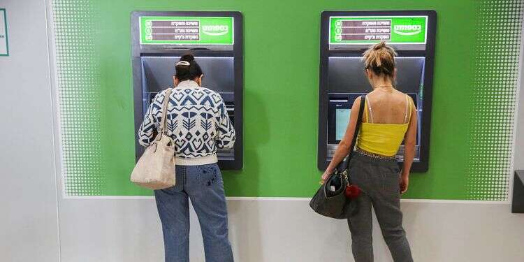 Israelis at an ATM, Monday We need an emergency social aid budget, now