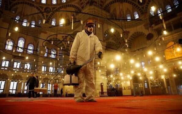 A worker in a protective suit disinfects the Fatih Mosque in Istanbul, Turkey Arab world races to contain coronavirus outbreak