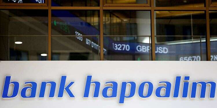 The logo of Bank Hapoalim is seen at their main branch in Tel Aviv, Israel Israel's Bank Hapoalim to pay $870 million to end US tax probe
