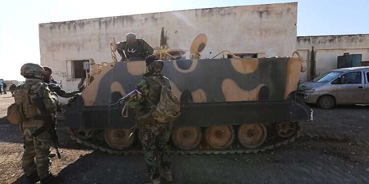 Turkish backed rebel fighters prepare for an attack near the village of Neirab in Idlib province, Syria, Thursday, Feb. 20, 2020 Turkey launches massive operation in northern Syria to counter Assad's forces