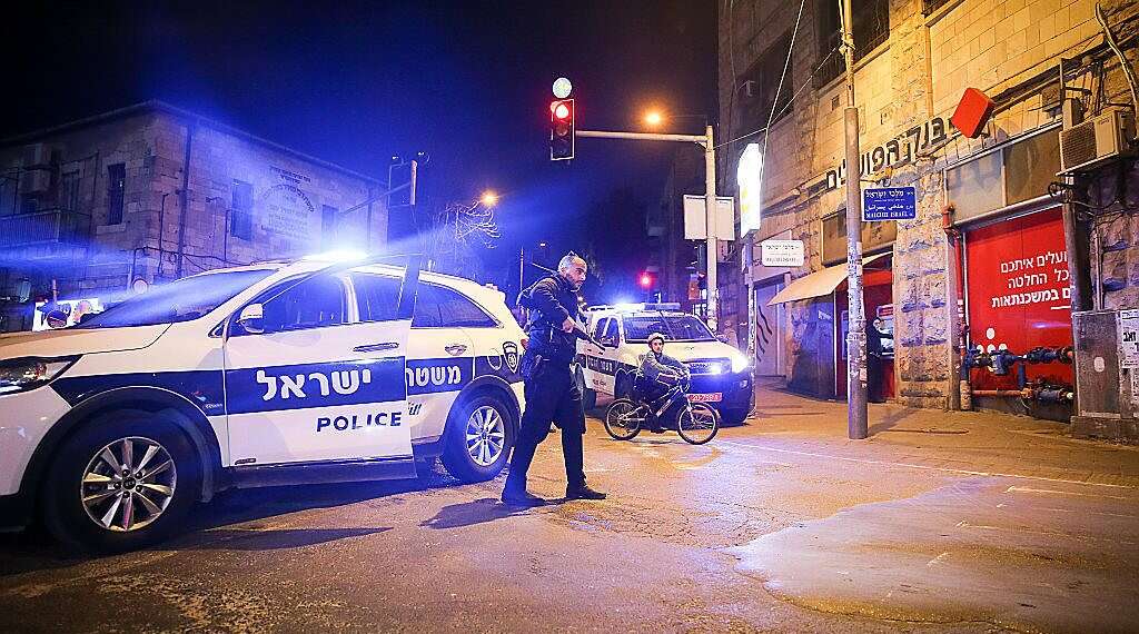 An Israel Police car in Jerusalem enforcing coronavirus-related emergency measures Gov't approves Passover curfew banning most Israelis from streets