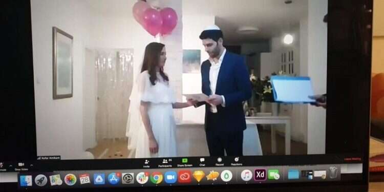 Mazal tov! 150 guests log on to watch couple wed via videoconference  
