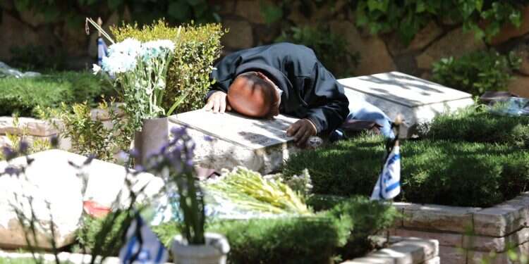 Israel mourns its fallen under tightened virus restrictions