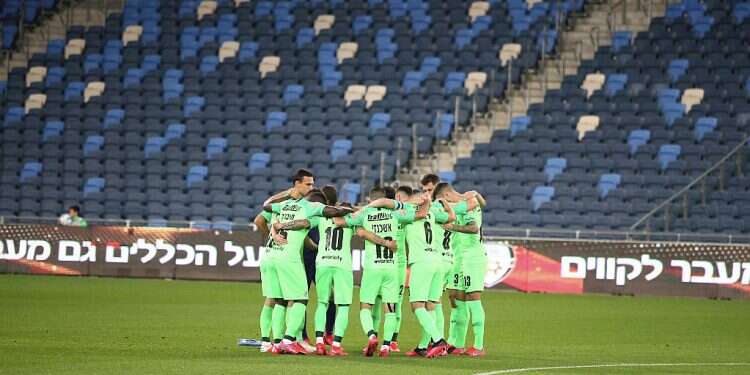 Maccabi Haifa soccer player in an empty stadium last month After getting kicked by corona, Israeli Premier League set to resume