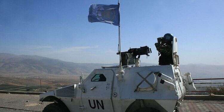 A peacekeeper of the United Nations Interim Force in southern Lebanon (UNIFIL) sits atop his armoured personel carrier as he monitors the border between Lebanon and Israel Israel demands major changes in UN peacekeeping force in Lebanon