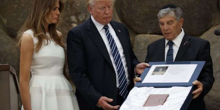 First lady Melania Trump watches as Avner Shalev, chairman of the Yad Vashem Directorate, presents President Donald Trump a replica of a personal notebook of holocaust victim Ester Goldstein, in Jerusalem Chairman of Israel's Yad Vashem to step down after 27 years