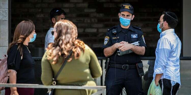 Jerusalem's Mahane Yehuda outdoor market Nearly 2/3 of Israeli corona cases were contracted at home