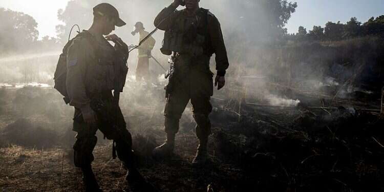 IDF soldiers battle fires caused by arson balloons launched from Gaza IDF strikes Hamas targets in Gaza amid ongoing arson attacks