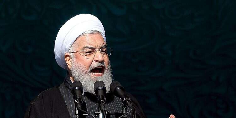 Iranian President Hassan Rouhani speaks during a ceremony celebrating the 41st anniversary of the Islamic Revolution, at the Azadi, Freedom, Square in Tehran, Iran Iran sentences 2 men to prison over spying for Israel, West