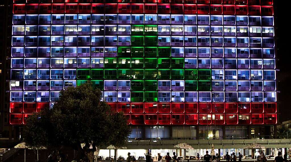 In show of support, Tel Aviv square lights up with colors of Lebanese flag