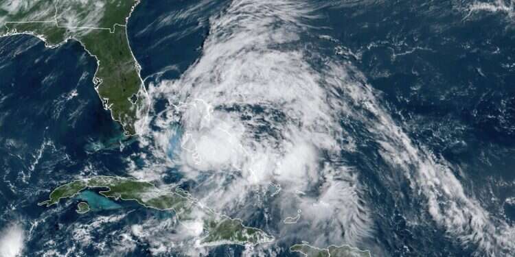 This GOES-16 GeoColor satellite image taken Saturday, Aug. 1, shows Hurricane Isaias over the Bahamas Hurricane Isaias nears virus-hit Florida