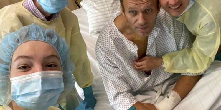 This handout photo published by Russian opposition leader Alexei Navalny on his instagram account, shows himself, centre, and his wife Yulia, right, daughter Daria, and son Zakhar, top left, posing for a photo in a hospital in Berlin, Germany. Russian opposition leader Alexei Navalny has posted the picture of himself in a hospital in Germany and says he's breathing on his own Navalny team alleges Novichok found in hotel water bottle