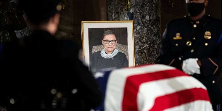The flag-draped casket of Justice Ruth Bader Ginsburg lies in state in the US Capitol on Friday, Sept. 25, 2020 Ruth Bader Ginsburg becomes first woman to be laid in state