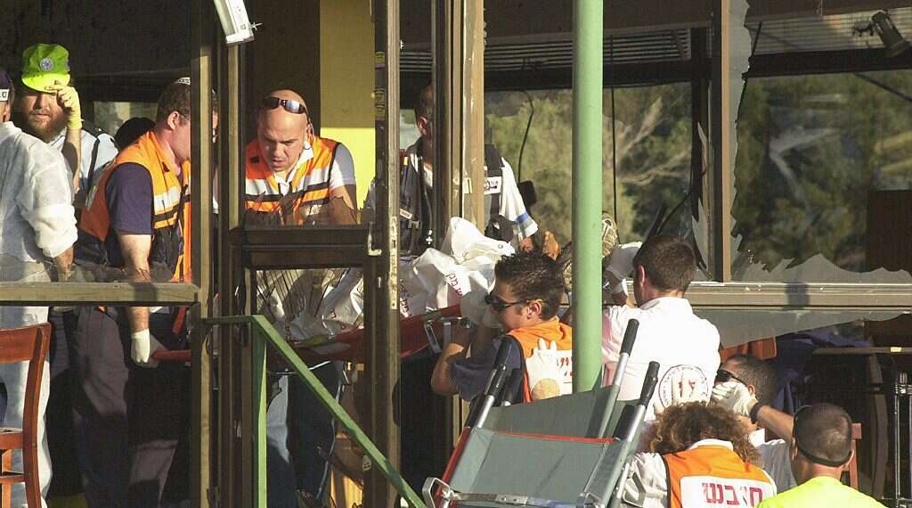 First responders at the scene of the suicide bombing at the Maxim restaurant in Haifa on Oct. 4, 2003. 21 people were killed, including four children, and 51 were injured. Implement the big lesson of the Intifada: Initiate and control