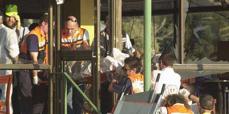 First responders at the scene of the suicide bombing at the Maxim restaurant in Haifa on Oct. 4, 2003. 21 people were killed, including four children, and 51 were injured. Implement the big lesson of the Intifada: Initiate and control