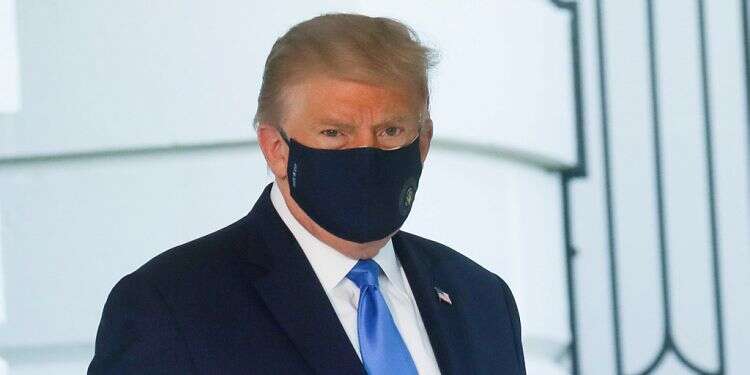 US President Trump walks to the Marine One helicopter wearing a protective face mask as he departs the White House to fly to Walter Reed National Military Medical Center, Oct. 2, 2020 Trump says feeling better, hopes to put virus scare behind him soon