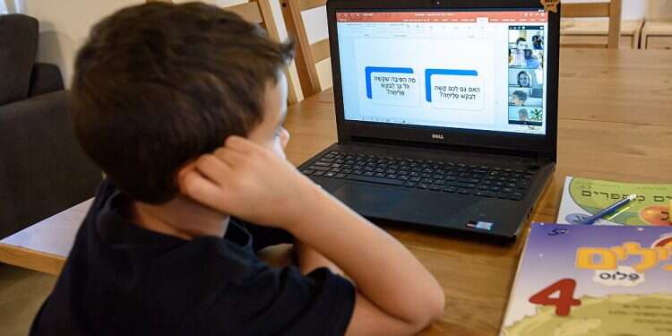 Second-grader Raz Avital is seen during a Zoom lesson Educators fearful COVID distance learning will lead to 'lost generation'
