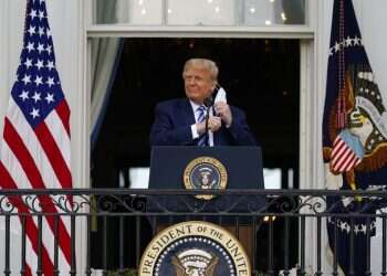 President Donald Trump removes his face mask to speak from the Blue Room Balcony Doctor says Trump not contagious, stays mum on tests