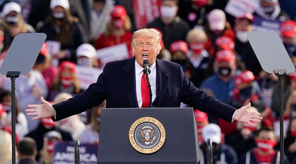 President Donald Trump speaks during a campaign rally at Manchester-Boston Regional Airport, Oct. 25, 2020 Race to the White House: Trump against the rest