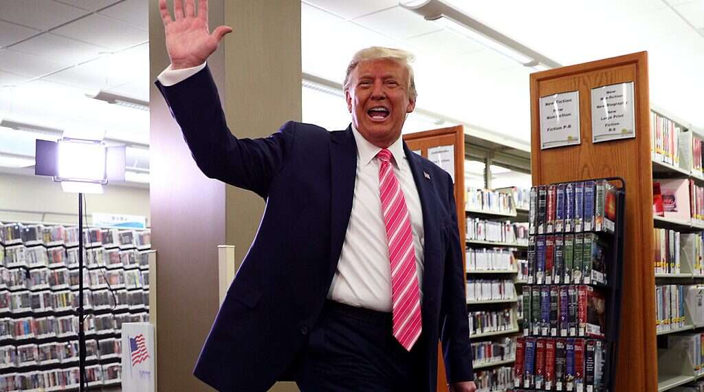 US President Donald Trump waves after voting in the 2020 presidential election at the Palm Beach County, Oct. 24, 2020 Calmer Trump turns new leaf, builds momentum