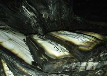 Man suspected of breaking into synagogue, burning Torah scrolls