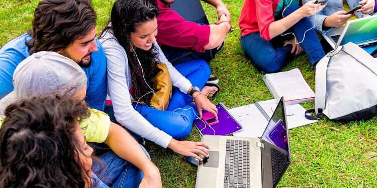 Group of college students studying at university campus