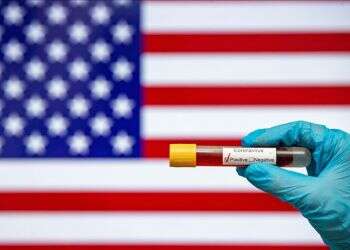 US sets single-day record for COVID-19 cases during new surge