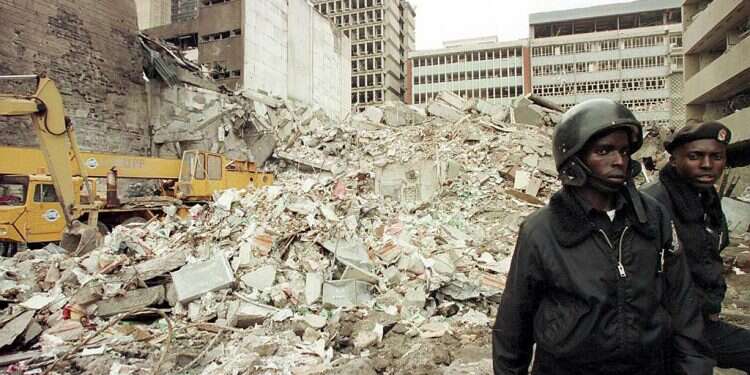 Kenyan security guards keep watch over the scene of the explosion near the US embassy in Nairobi in 1998 Families of Al-Qaida victims 'extremely thankful' to Mossad after reported hit