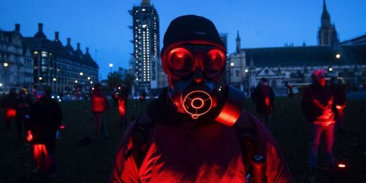 Backdropped by parliament, backstage technical crews who support the performing arts industry demonstrate to call for more government funding for the performing arts, in Parliament Square, London, Oct. 31, 2020 UK to enter new lockdown as COVID cases pass 1 million