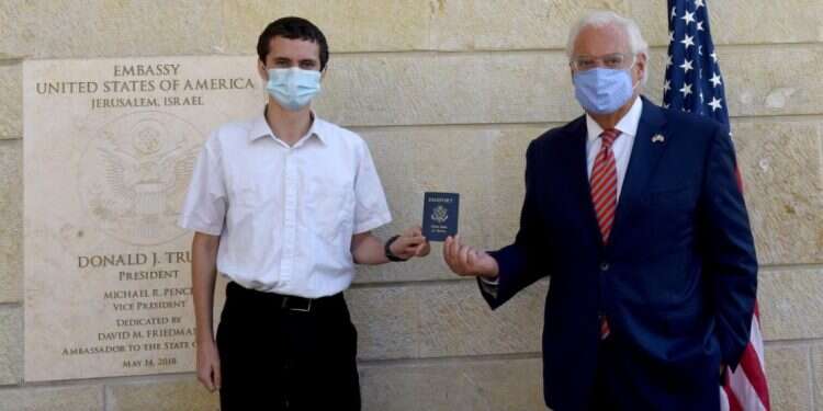 US Ambassador to Israel David Friedman presents Menachem Zivotofsky, a US citizen who was born in Jerusalem, his passport that lists Israel as birthplace at the US Embassy in Jerusalem, Oct. 30, 2020 First Jerusalem-born American gets US passport that lists 'Israel' as birthplace