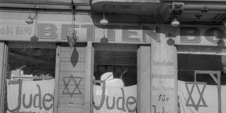 A Jewish-run shop in Berlin bearing anti-Semitic graffiti is seen during the Kristallnacht pogrom in June 1938 International March of the Living shines light on Kristallnacht with new campaign
